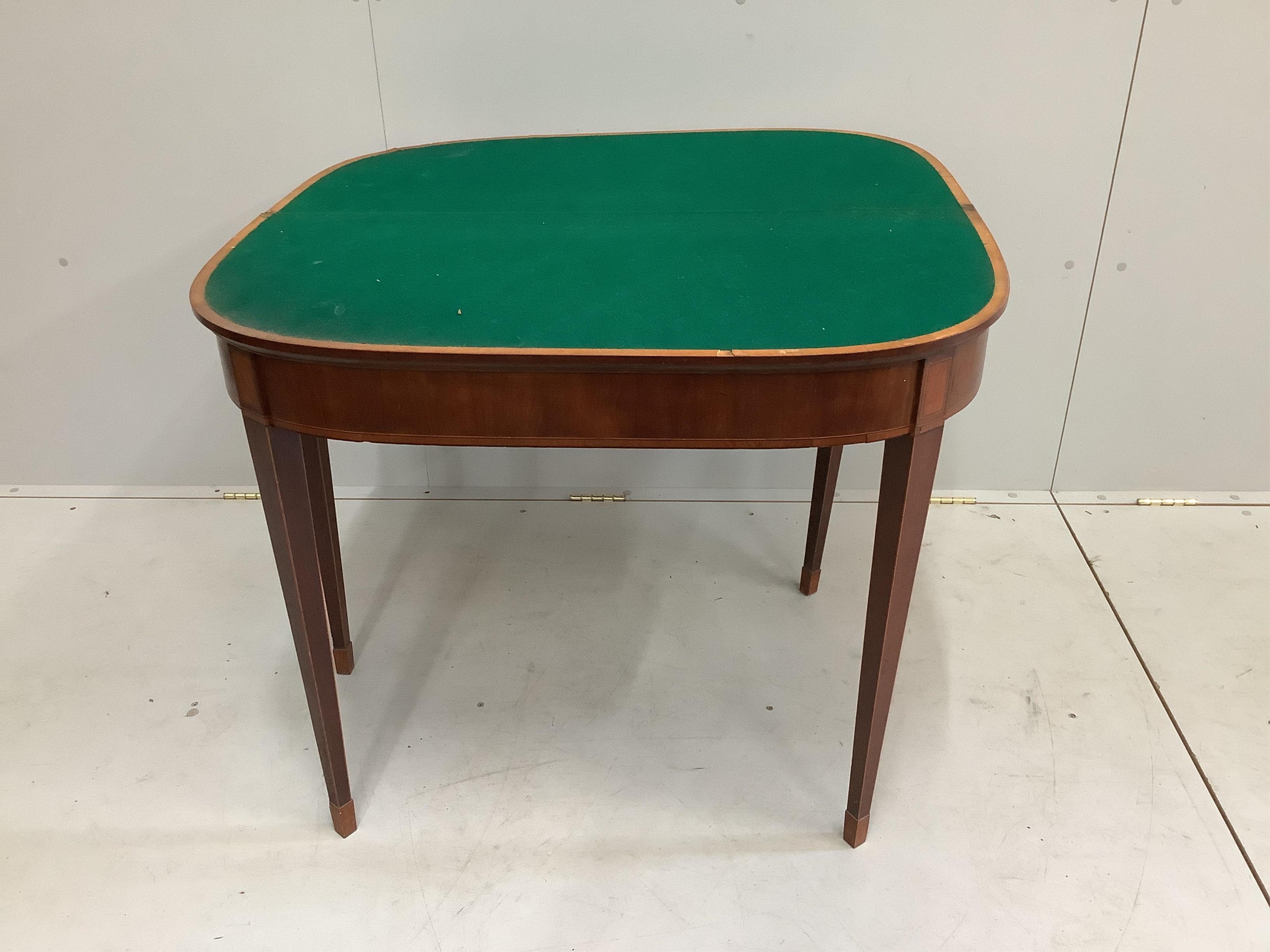 A George III satinwood banded mahogany D shaped folding card table, width 91cm, depth 45cm, height 75cm